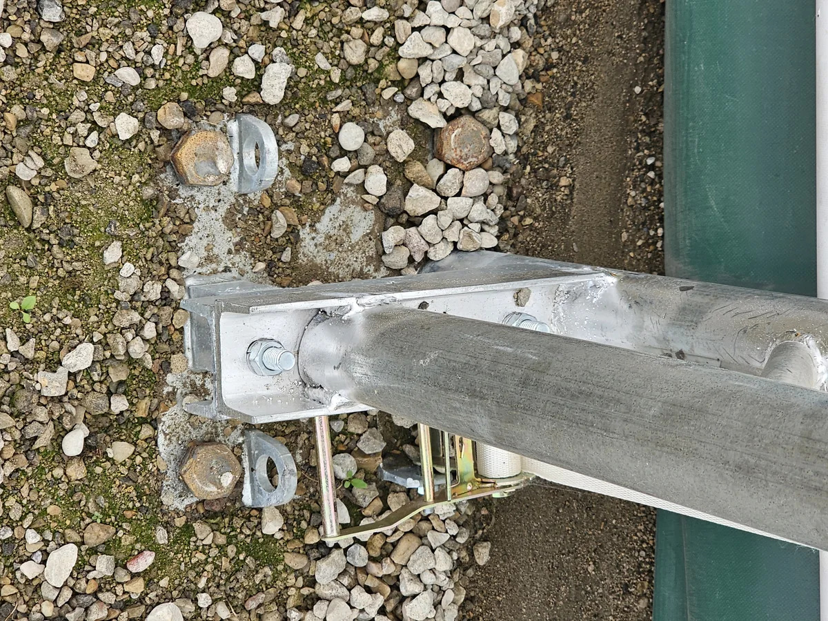 Close view of a steel frame base plate and fixings